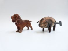 English clockwork tin-plate pig with original key together with a bronze model of a dog.