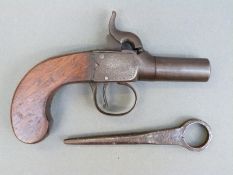 Percussion and hammer action pistol with indistinctly named engraved lock, shaped walnut grip,