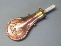 G & J W Hawksley copper and brass powder flask with embossed scenes to both sides of a man shooting