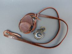 A leather cased Mordan WWI marching compass stamped 1917