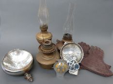 A quantity of motoring collectables including AA and RAC badges, spot lamps, gloves,