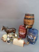 Three ceramic and oak sherry barrels,