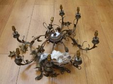 An eight branch chandelier with floral decoration.