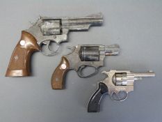 Three replica revolvers including Precise 880 and Mod SW8,