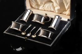 A cased five-piece hallmarked silver cruet set comprising two open salts and mustard,