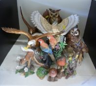 A quantity of bird figures including Beswick bald and golden eagles, whisky decanters, Goebel owl,
