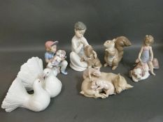 Six boxed Lladro figures comprising Kissing Doves, Playful Piglets, Continental Companion,