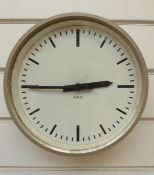 A GPO wallclock with electric movement and baton numerals,