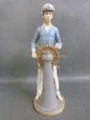 A Lladro figure of a sailor or helmsman