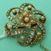 A 15ct gold Edwardian brooch / pendant set with seed pearls and aquamarines