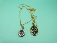 A 9ct gold pendant set with sapphires and diamonds in a floral design on a 9ct gold chain and