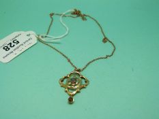 A 9ct gold Edwardian pendant on yellow metal chain