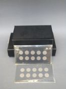 An amateur collection of English florins mounted in cards, ranging from 1947-1950,