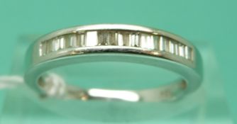 An 18ct white gold ring set with baguette cut diamonds, total diamond weight approximately 0.