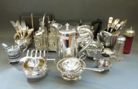 A quantity of silver plated ware to include four-bottle cruet, teaset, silver-topped sugar caster,