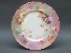 Royal Doulton cabinet plate with raised gilt edge, decorated with roses on a blush ground,