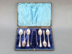 A cased set of six Victorian hallmarked silver teaspoons and tongs, Sheffield 1896,