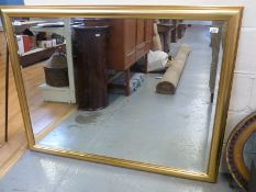 A gilt framed bevelled edge mirror (overall size 104cm x 134cm)