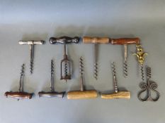 A quantity of vintage corkscrews including an unusual blacksmith made example