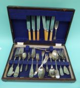 A canteen of cutlery in an oak case