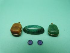 A turquoise cabochon, tiger's eye pendant,