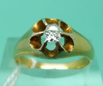 An 18ct gold ring set with cushion cut diamond of approximately 0.