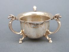 George V three-footed hallmarked silver salt with lions mask decoration, Sheffield 1927,