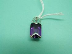 An 18ct white gold pendant set with an emerald cut amethyst by Criso