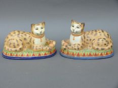 A pair of Staffordshire style cats,