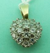 An 18ct gold pendant set with diamonds in a heart shaped cluster
