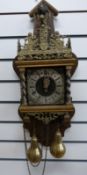 A Dutch mid 20thC Stoelklok with brass weight driven two train movement striking on a bell and