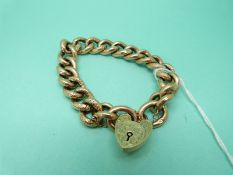 A 9ct gold Edwardian bracelet with chased decoration to some links, approximately 23cm (20.