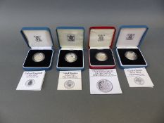 Four cased Royal Mint silver proof £1 coins comprising 1983, 1986,