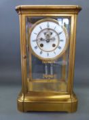 A four glass late 19thC brass mantel clock, the two-train movement by F.