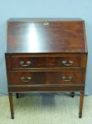 A mahogany bureau, the fall flap opening to reveal fitted interior,