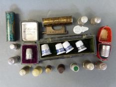 A quantity of cased and loose thimbles,