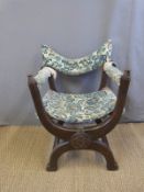An oak cross framed Gothic style armchair