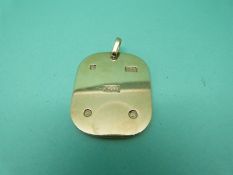 A 9ct gold ingot (23.