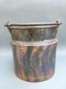 A copper swing-handled bucket,