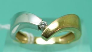 A 9ct bi-coloured gold ring set with a diamond (size M), weight 2.