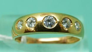 A yellow metal ring set with graduating cubic zirconia (size M)