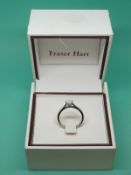 A platinum ring set with a modern round brilliant cut diamond measuring 0.