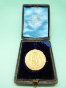 A yellow metal Irish mathematics medal dated 1887, in original box, 27.