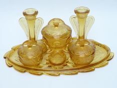 Pressed amber glass seven piece dressing table set in tray