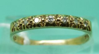 An 18ct gold ring set with diamonds (size O), weight 2.