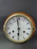 A Schatz brass Royal Mariner ship's bulkhead clock, the two train 8 day movement striking on a bell,