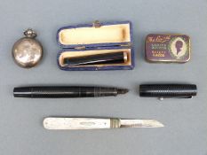 A hallmarked silver sovereign holder, mother of pearl silver bladed fruit knife,