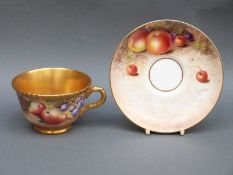 Royal Worcester painted fruit cup and saucer with gilt interior,