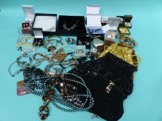 A quantity of costume jewellery, tiger's eye pendant,