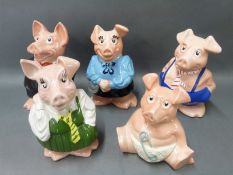 A set of five Nat West pigs